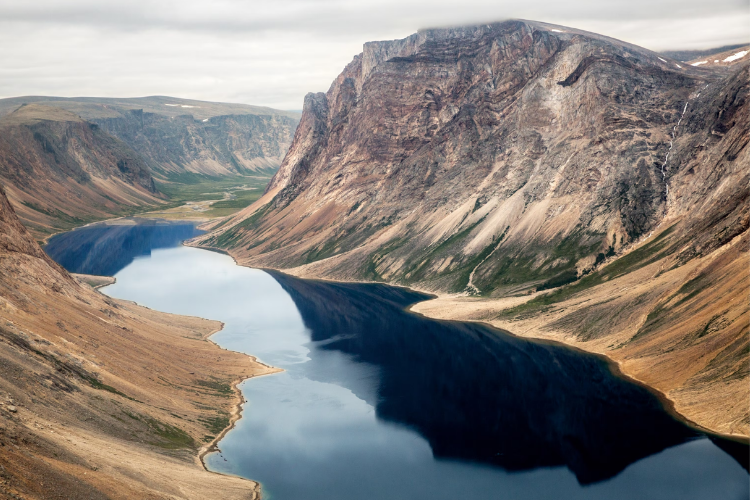 A breathtaking view of the rugged U-shaped glacial valleys and fjords of Torngat Mountains National Park in northern Labrador.