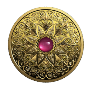A Canadian pure gold collector coin featuring a symmetrical mandala design with a central pink gemstone